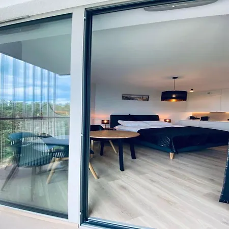 Apartament In By The